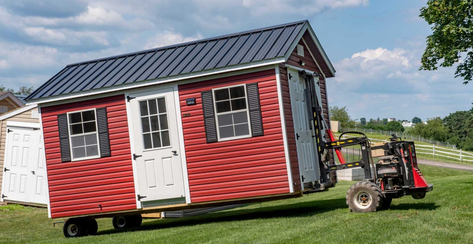 6579c0bd47aafce3f05d920b red shed being moved on wheels