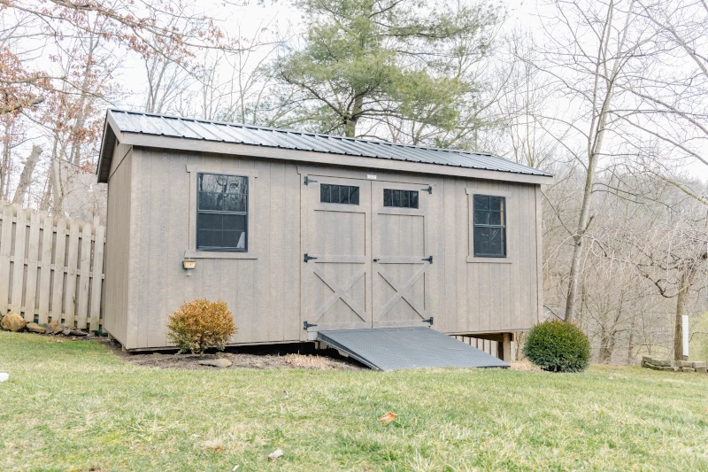 smart siding shed with doubles doors and raised on one side